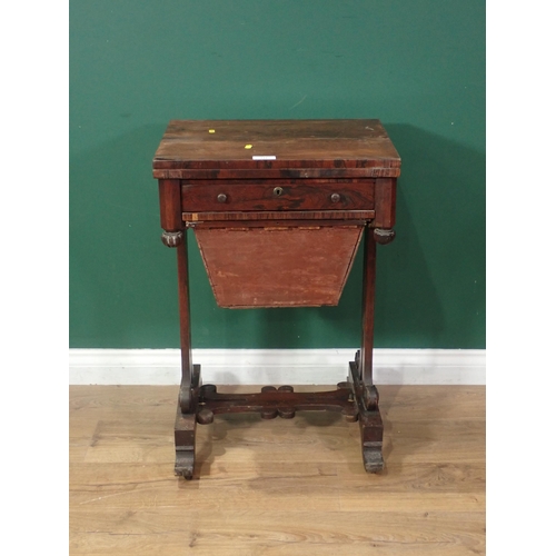 731 - A rosewood Writing/Work Table with fold-over rotating top, fitted frieze drawer and solid basket bel... 