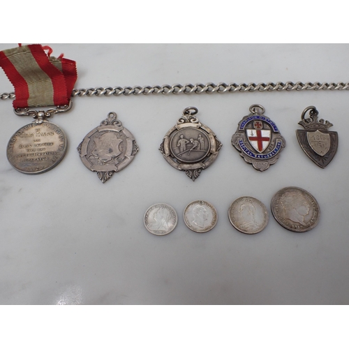 86 - A silver Watch Chain, four silver Medallions, a George III Shilling, 1817, a Sixpence, 1887, an Edwa... 