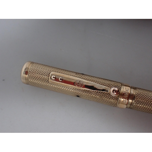 96 - A 9ct gold cased 'Ideal' Fountain Pen with engine turning and initials, and a similar silver cased F... 