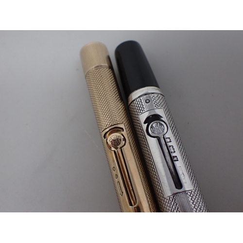 96 - A 9ct gold cased 'Ideal' Fountain Pen with engine turning and initials, and a similar silver cased F... 