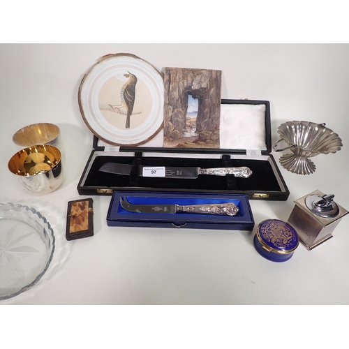 97 - A silver-handled Bread Knife and Cheese Knife, a pair of Tumblers, an enamel Box, a Ronson Lighter, ... 