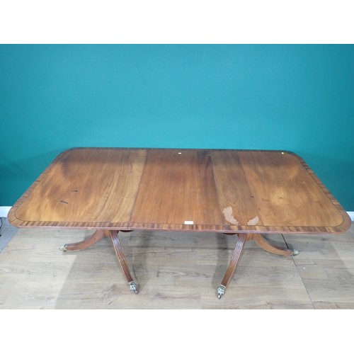 365 - A 1920's George III style mahogany and crossbanded twin pedestal Dining Table with spare leaf 6ft 6i... 