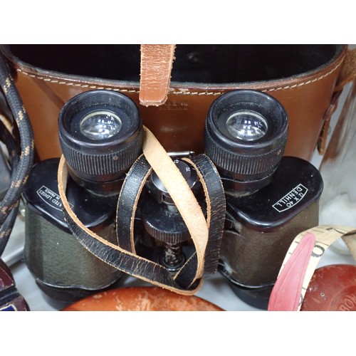 329 - A pair of Barr & Stroud, Binoculars in case A/F, two leather cased Tape Measures, a Boucher's system... 