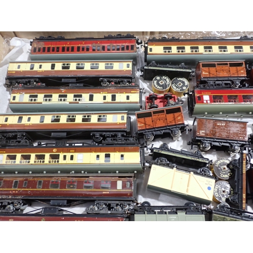 103 - A box containing thirty Hornby-Dublo Coaches and Wagons including G.W.R. Brake Van and Packing Van