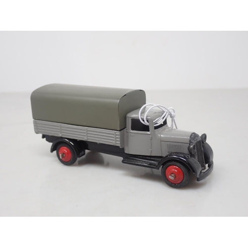 124 - A Dinky Toys 25B/4 grey Covered Wagon with red hubs