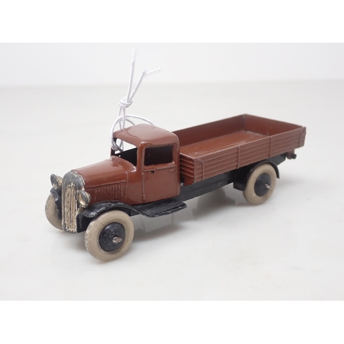 126 - A Dinky Toys 25E brown Tipper Lorry with smooth hubs and white tyres