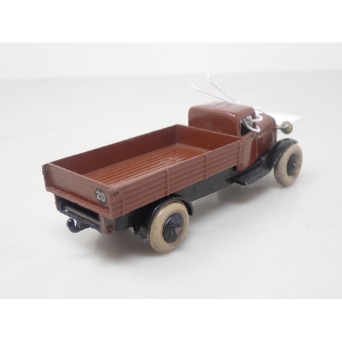 126 - A Dinky Toys 25E brown Tipper Lorry with smooth hubs and white tyres