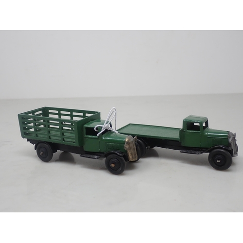 142 - A Dinky Toys No.25f green Market Garden Truck and a 25c green Flat Truck