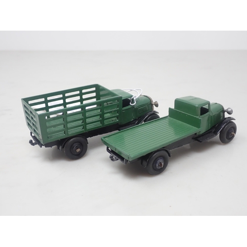 142 - A Dinky Toys No.25f green Market Garden Truck and a 25c green Flat Truck