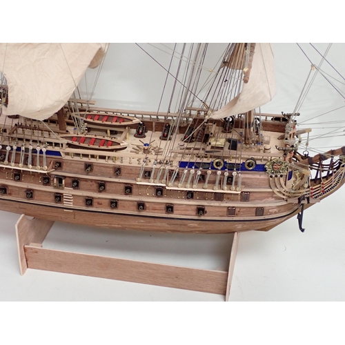 179 - A kit built wooden Model of a three mast War Ship 2ft 8in L x 2ft 4in H