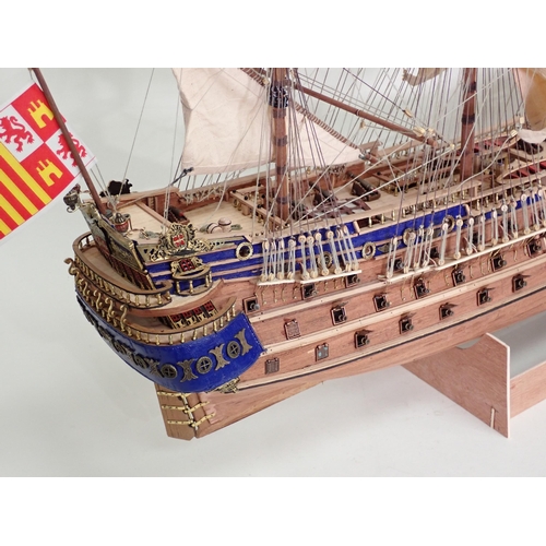 179 - A kit built wooden Model of a three mast War Ship 2ft 8in L x 2ft 4in H