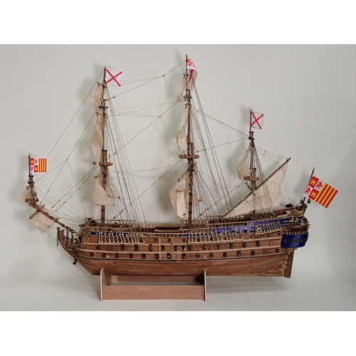 179 - A kit built wooden Model of a three mast War Ship 2ft 8in L x 2ft 4in H