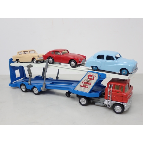 196 - A repainted Dinky Toys Pullmore Car Transporter, three Buses and seven Cars including Jaguar 3.4 lit... 