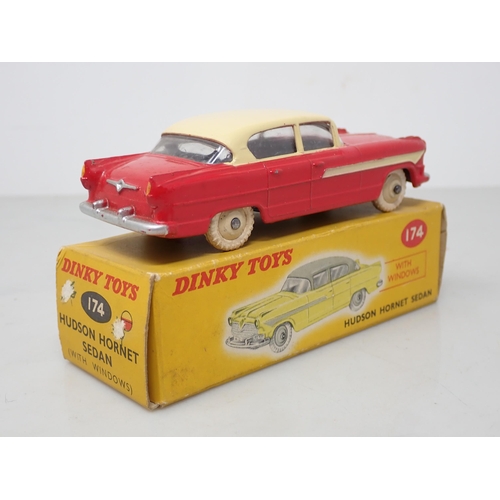 204 - A boxed Dinky Toys No.174 red and cream Hudson Hornet Sedan