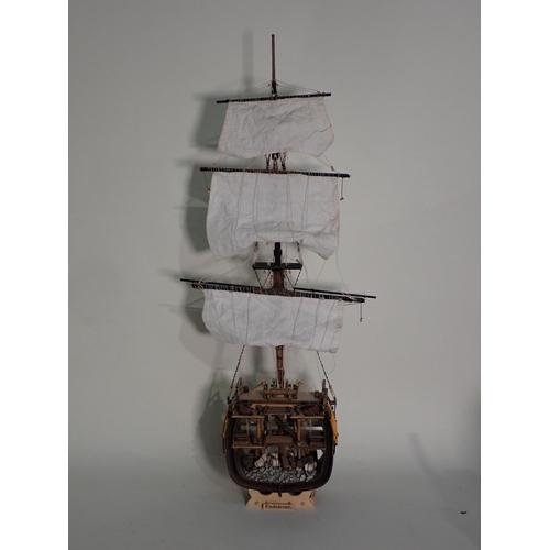 220 - A kit built wooden Model of the 'Black Pearl' and two cut away sections of Warships