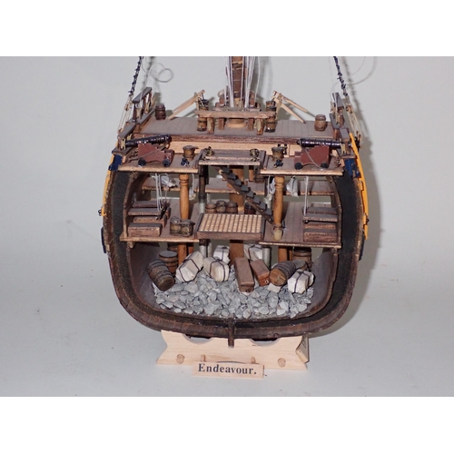 220 - A kit built wooden Model of the 'Black Pearl' and two cut away sections of Warships