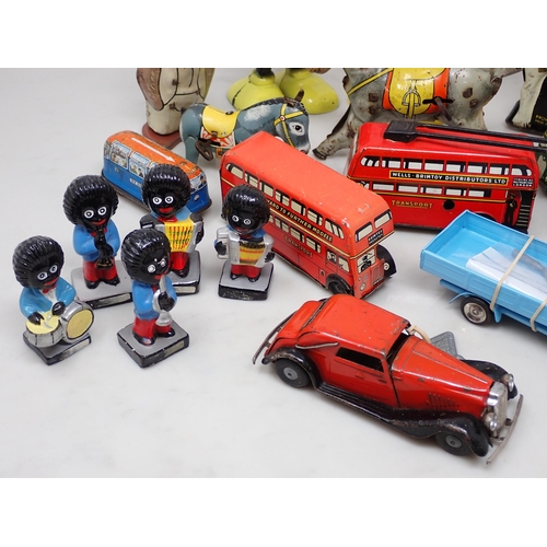 257 - A box of plastic and tinplate Toys including Mickey Mouse, Drummer on horse, Buses and a collection ... 