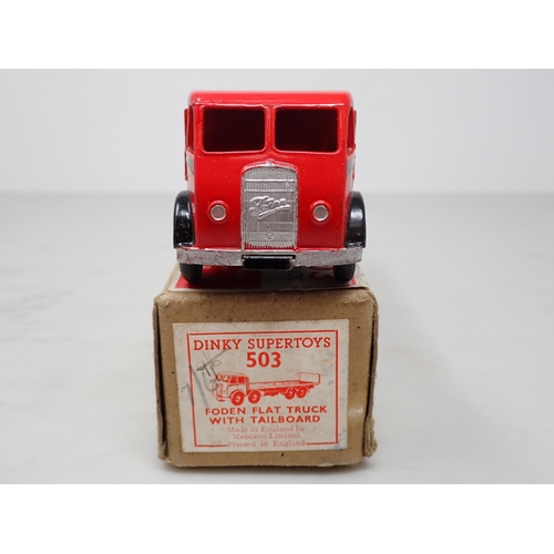 263 - A boxed Dinky Toys No.503 red and black Foden Flat Truck with tailboard