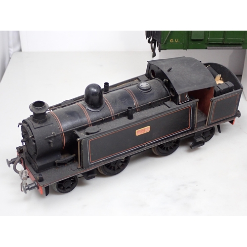 319 - Three scratch built 0 gauge clockwork Locomotives with assorted Tenders, a Cattle Wagons and a Bogie... 