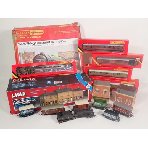 321 - A Hornby 'Flying Scotsman' Set in damaged box, five boxed Hornby Coaches, a boxed Lima Station and a... 