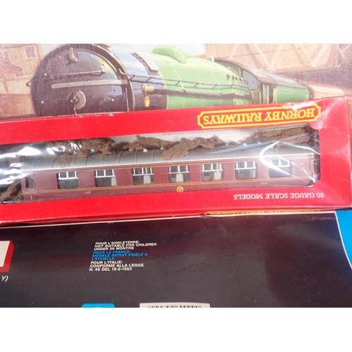 321 - A Hornby 'Flying Scotsman' Set in damaged box, five boxed Hornby Coaches, a boxed Lima Station and a... 