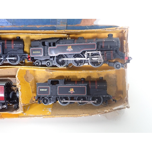 323 - A Hornby-Dublo 3-rail 2-6-4T No.80054, two unboxed 3-rail 0-6-2T Locomotives, two Coaches and three ... 