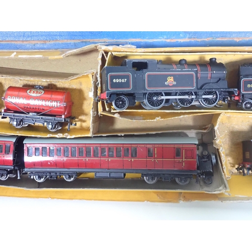 323 - A Hornby-Dublo 3-rail 2-6-4T No.80054, two unboxed 3-rail 0-6-2T Locomotives, two Coaches and three ... 