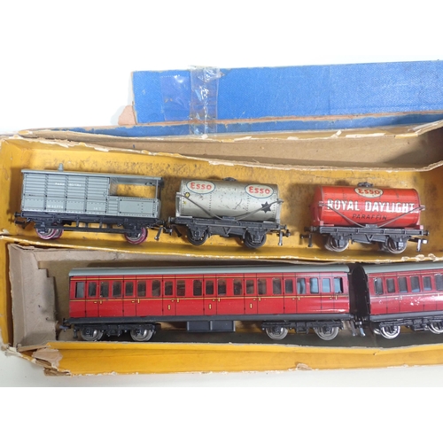 323 - A Hornby-Dublo 3-rail 2-6-4T No.80054, two unboxed 3-rail 0-6-2T Locomotives, two Coaches and three ... 