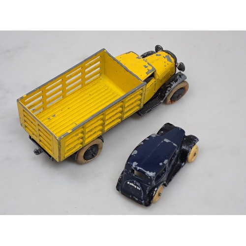 333 - A Dinky Toys No.25f yellow Market Garden Wagon and a No.35a blue Saloon Car