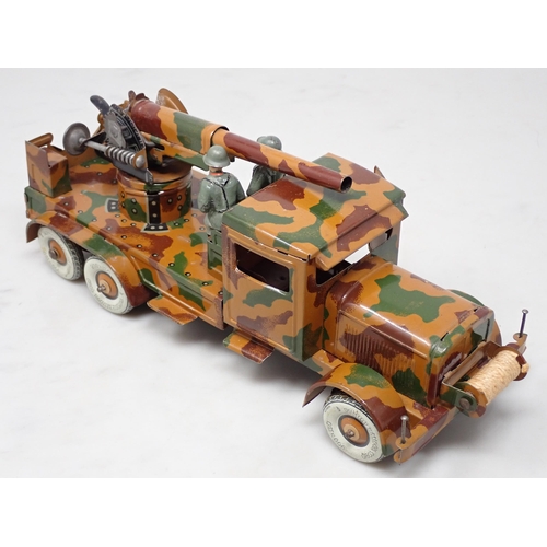 396 - A tinplate Tipp & Co. clockwork 6-wheel German Lorry with anti-aircraft Gun and two composite Figure... 