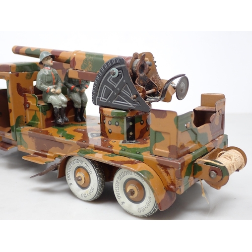 396 - A tinplate Tipp & Co. clockwork 6-wheel German Lorry with anti-aircraft Gun and two composite Figure... 