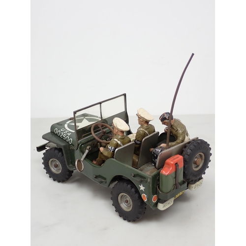 398 - An Arnold tinplate Military Police Jeep with three composite Figures, generally excellent