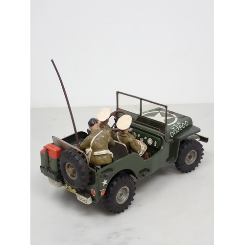 398 - An Arnold tinplate Military Police Jeep with three composite Figures, generally excellent