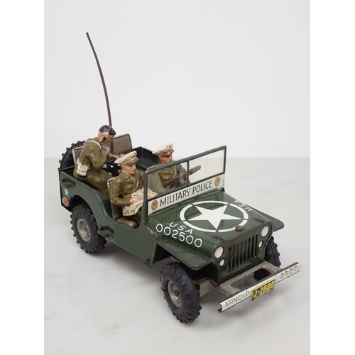 398 - An Arnold tinplate Military Police Jeep with three composite Figures, generally excellent