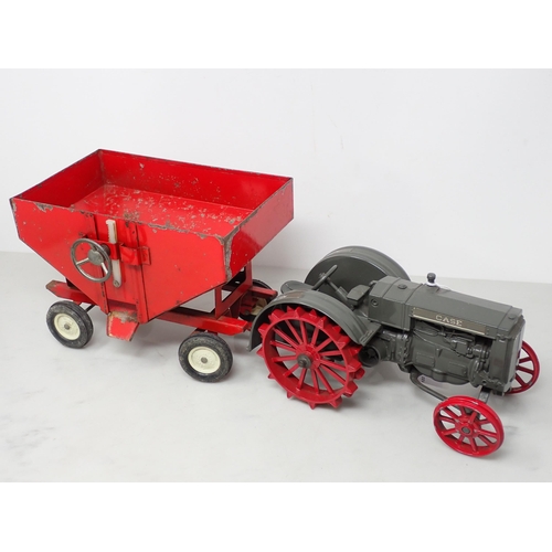 411 - A metal Model of a Case Tractor and Hopper Trailer and a tinplate Model of a red open seater Car