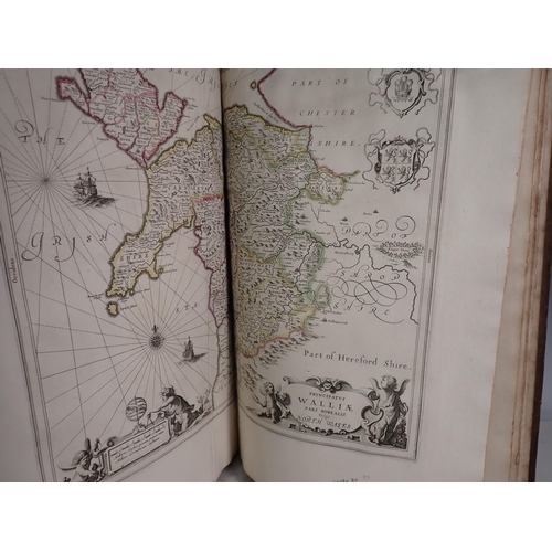 525 - A leather bound volume of County Maps by Robert Green, Robert Morden, Speede, etc, hand coloured, al... 