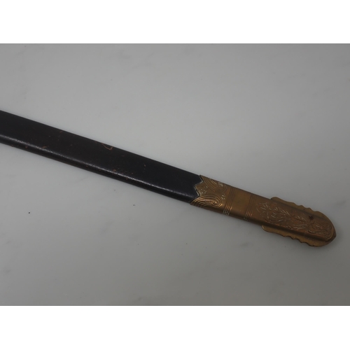 705 - A First World War Naval Dirk by Gieves with clean etched blade in brass mounted leather Scabbard, en... 