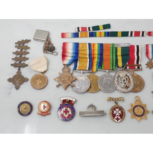 712 - A Group of Medals comprising 1914-15 Star, War Medal, Defence Medal, Territorial Efficiency Decorati... 