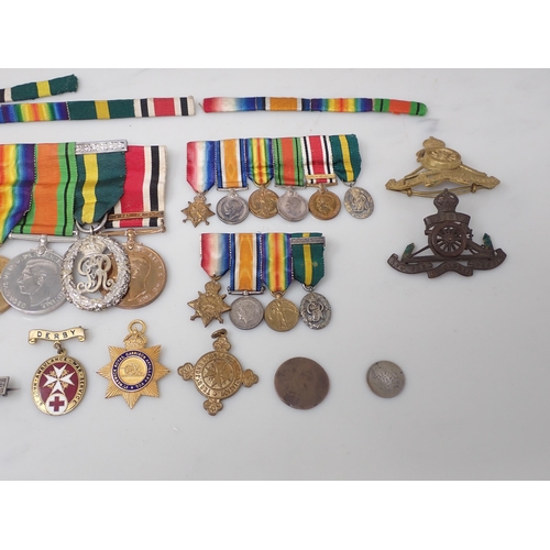 712 - A Group of Medals comprising 1914-15 Star, War Medal, Defence Medal, Territorial Efficiency Decorati... 