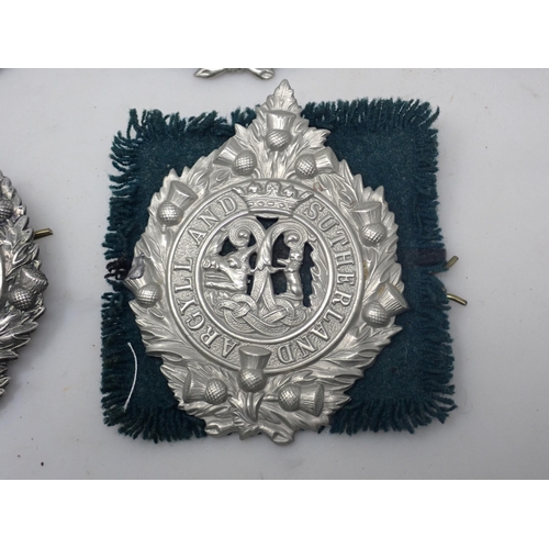 737 - Six Argyll & Sutherland Highlander Cap Badges, a Tyneside Scots Cap Badge and a Royal Scots Cap Badg... 