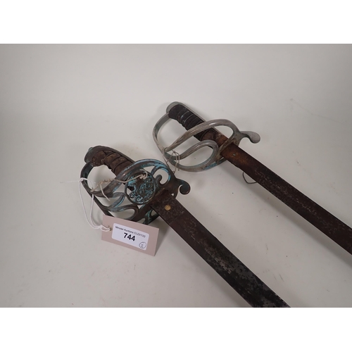 744 - Two British Military Swords (Both in a worn and rusty condition).