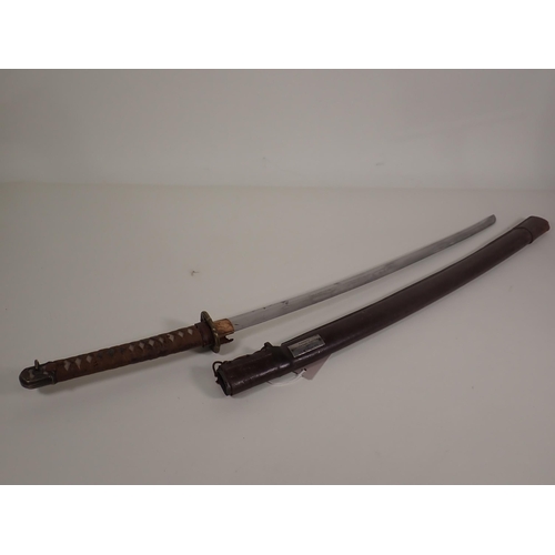 783 - A WWII Japanese Katana with plaque on scabbard stating 'Presented to Captain J.D.A. Coppin, Rajput R... 