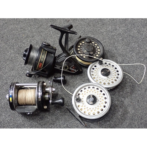 823 - Two boxes of Fishing items including Shakespeare Sigma Fixed Spool Reel, Abu Ambassadeur Multiplier ... 