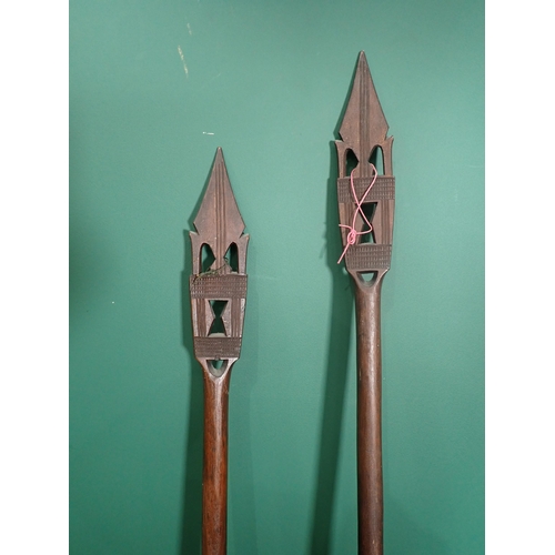 852 - Two carved hardwood Benin Ceremonial Paddles 5ft 1in L and 5ft 4in L