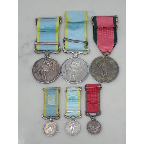 718 - Two Crimea Medals, both unnamed and both with Sebastopol Bar. Also a French issue Turkish Crimea Med... 