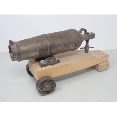 722 - An early 19th Century Signalling Cannon, barrel 13in L (pitted overall), a model Carronade and two d... 