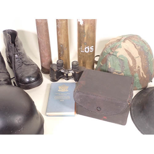 751 - A lot of Militaria comprising; German style Tunic. pair of Ammunition Boots, three Helmets, civilian... 