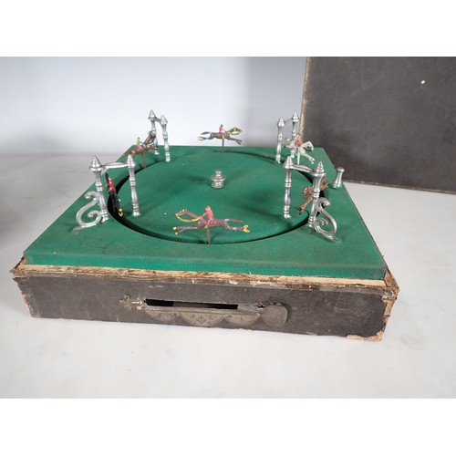 560 - A mechanical Horse Racing Game with horses being spring driven, maker initials 