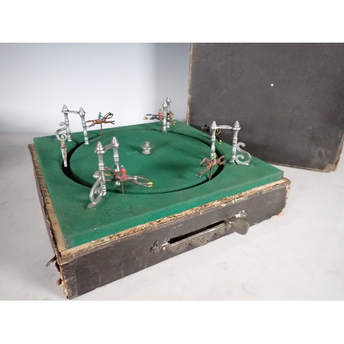 560 - A mechanical Horse Racing Game with horses being spring driven, maker initials 