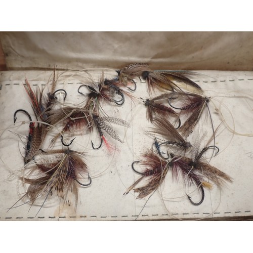 815 - A paper Rig Wallet containing approximately twenty Salmon and Sea Trout Flies, an old leather Fly Wa... 